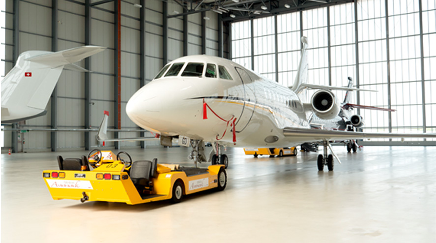 Business jets parked inside the Geneva Airpark heated hangar
